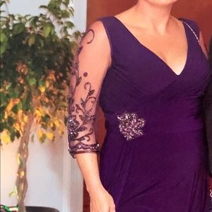 Gorgeous A-line dress with hand-beaded elbow length, illusion sleeves.